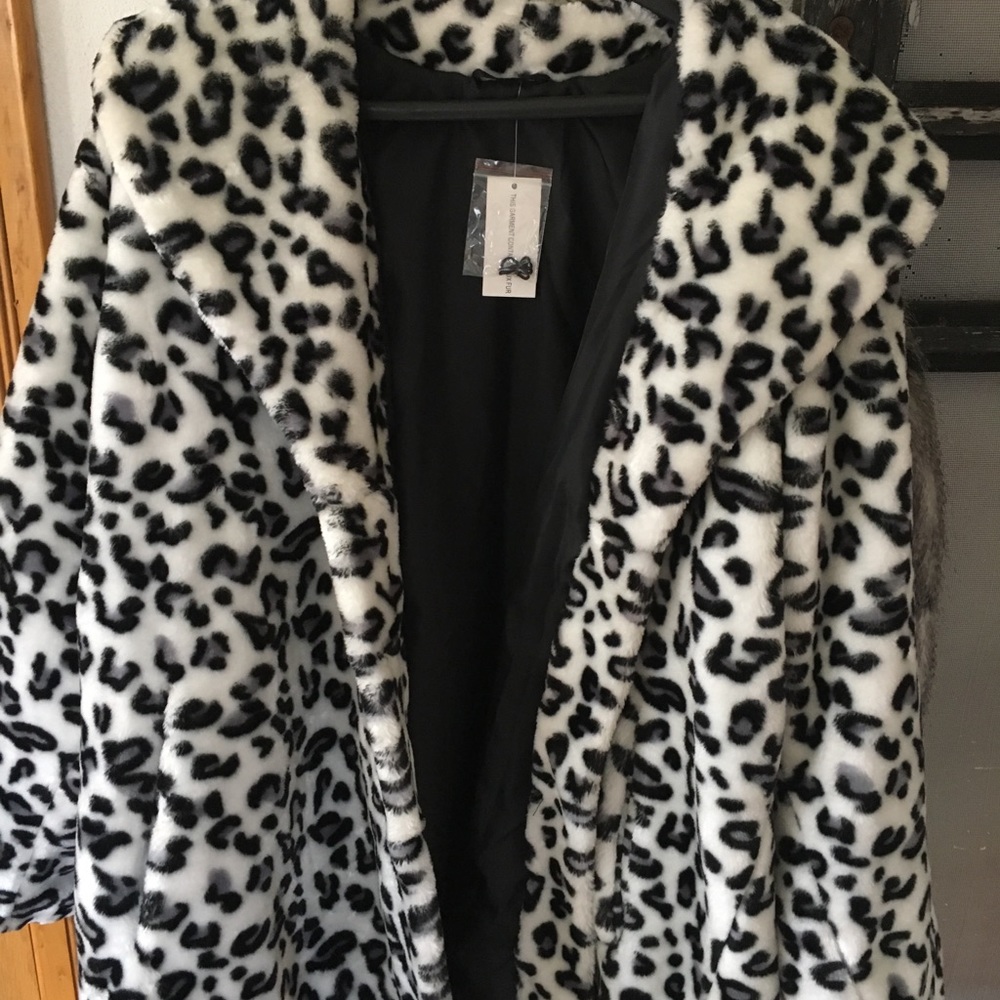 Brand new beautiful snow leopard  faux fur coat.